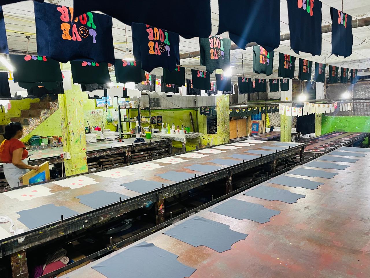 Skilled technicians working on custom apparel orders