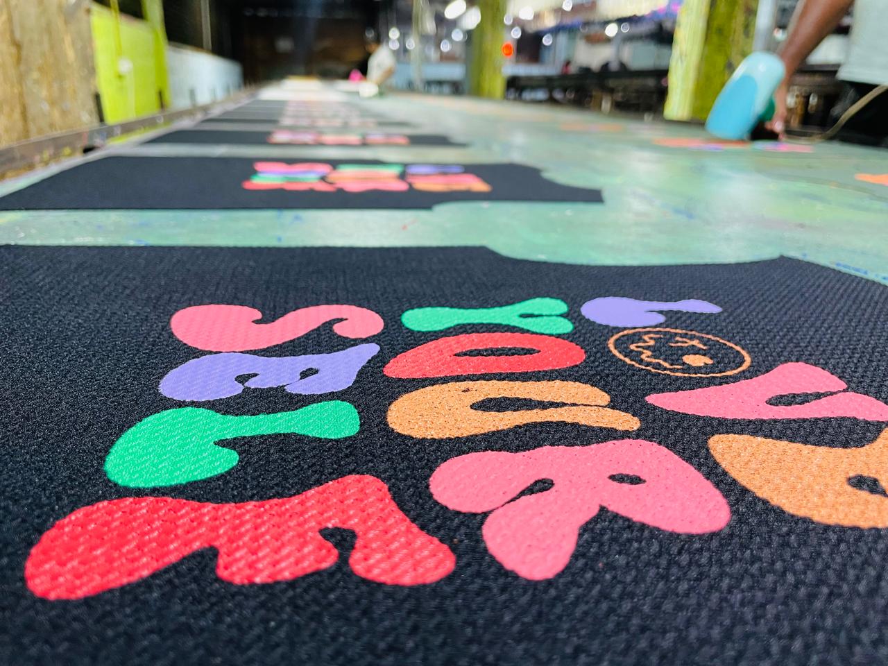 Screen printing process at K & K Advertising factory